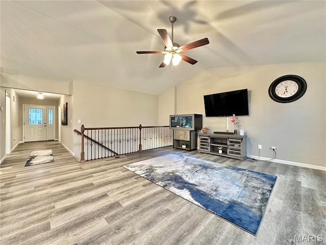 3553 Chippewa Dr, Shiloh, IL 62221 - living area featuring wood finished floors, vaulted ceiling, a ceiling fan, and baseboards