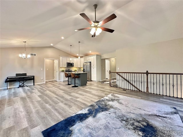 3553 Chippewa Dr, Shiloh, IL 62221 - living room with lofted ceiling, a ceiling fan, light wood-style floors, baseboards, and recessed lighting