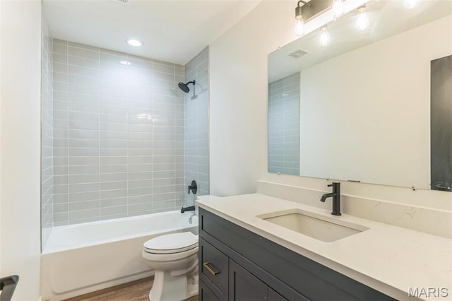 11 Forrester Dr, Manchester, MO 63011 - full bathroom with toilet, bathing tub / shower combination, vanity, and wood finished floors