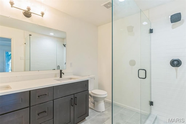 11 Forrester Dr, Manchester, MO 63011 - full bathroom featuring a stall shower, double vanity, tile patterned floors, and toilet