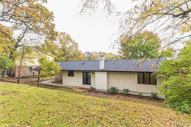 11 Forrester Dr, Manchester, MO 63011 - rear view of house featuring a patio, a yard, and a chimney