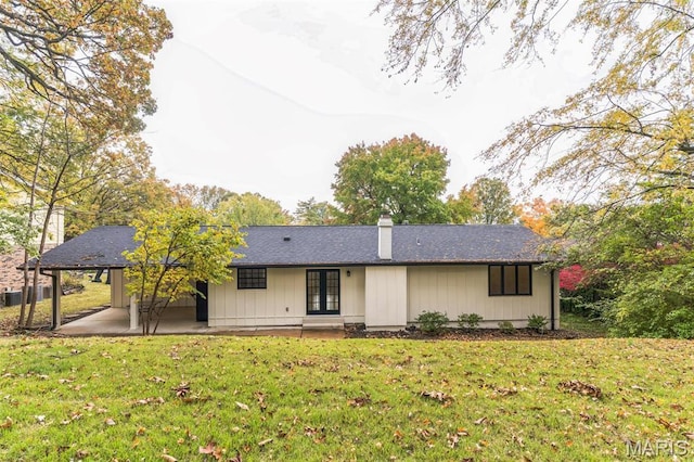 11 Forrester Dr, Manchester, MO 63011 - back of property featuring a patio, a chimney, a lawn, and cooling unit