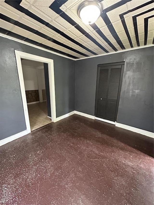 10140 Mayfair Dr, Saint Louis, MO 63136 - empty room with baseboards and light aggregate flooring