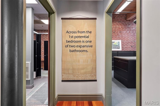 corridor featuring baseboards