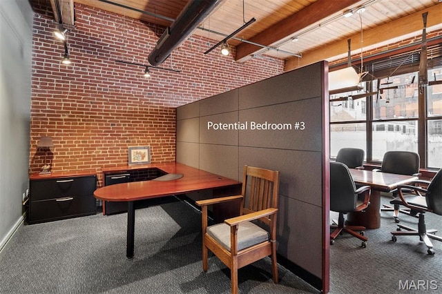 home office featuring carpet floors, brick wall, track lighting, wood ceiling, and baseboards