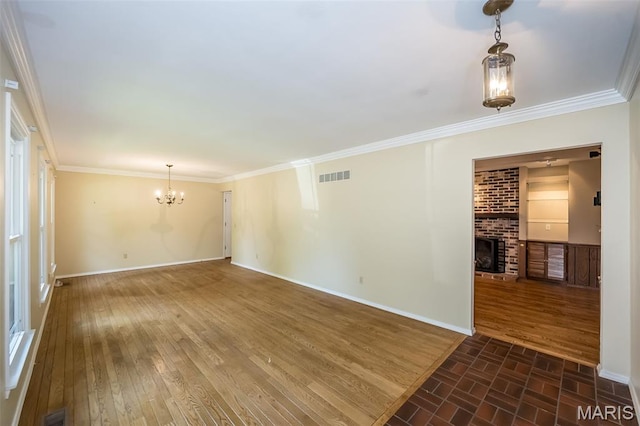 739 Muir View Dr, Ballwin, MO 63011 - empty room featuring a chandelier, a fireplace, baseboards, ornamental molding, and dark wood-style floors