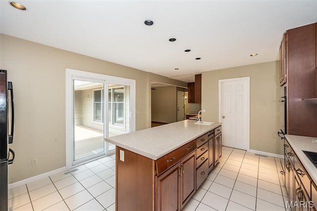 739 Muir View Dr, Ballwin, MO 63011 - kitchen with a sink, light countertops, light tile patterned floors, baseboards, and recessed lighting
