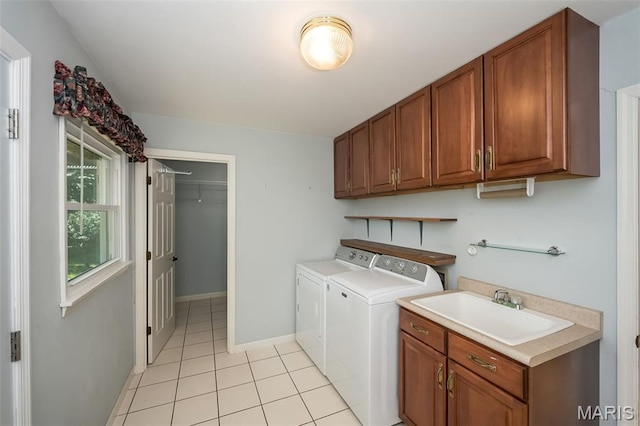 739 Muir View Dr, Ballwin, MO 63011 - laundry area with independent washer and dryer, light tile patterned floors, cabinet space, and baseboards