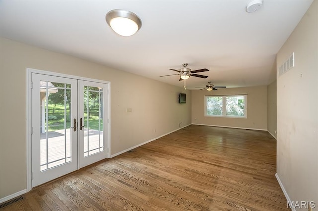 739 Muir View Dr, Ballwin, MO 63011 - empty room featuring french doors, a smoke detector, wood finished floors, and baseboards
