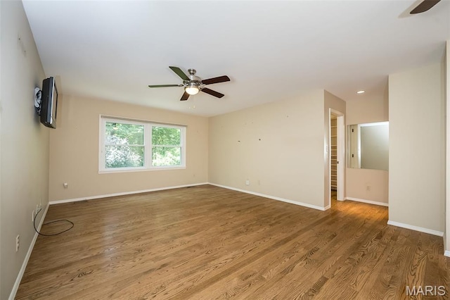 739 Muir View Dr, Ballwin, MO 63011 - empty room with a ceiling fan, wood finished floors, baseboards, and recessed lighting