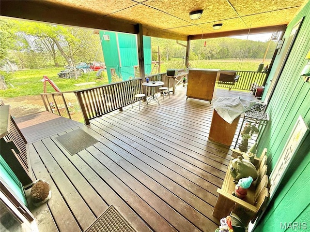deck featuring a yard