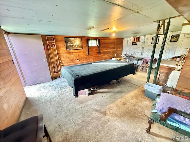 playroom featuring billiards table, wooden walls, and unfinished concrete floors
