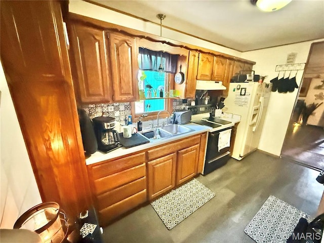 kitchen featuring under cabinet range hood, electric stove, white refrigerator with ice dispenser, a sink, and brown cabinets