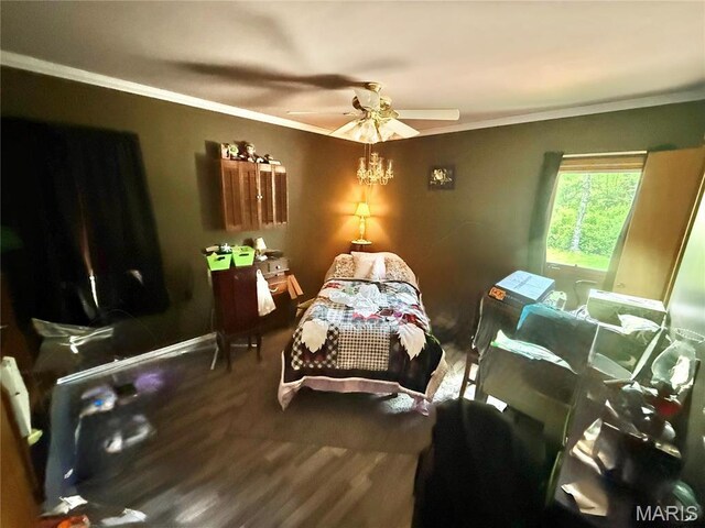 bedroom featuring crown molding, wood finished floors, ceiling fan, and baseboards