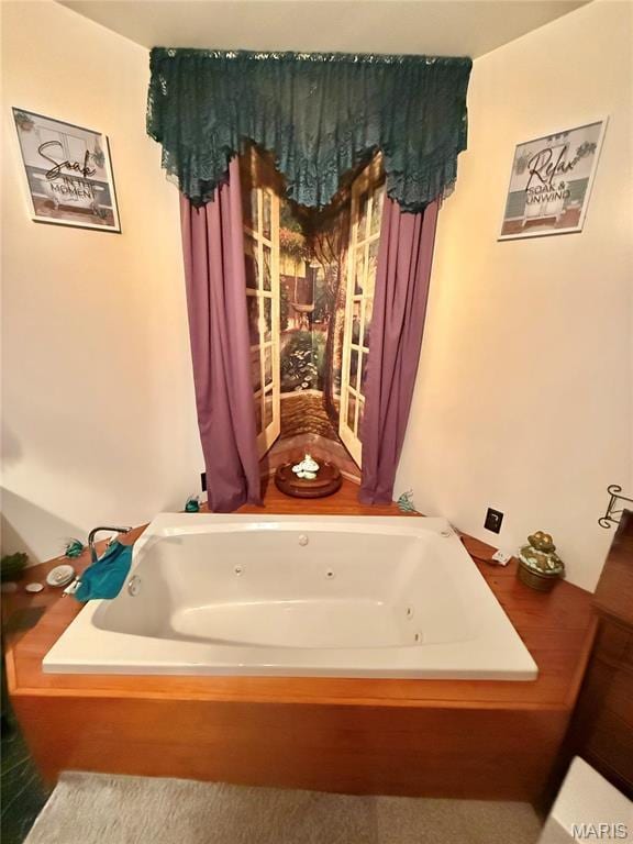 full bath featuring a jetted tub