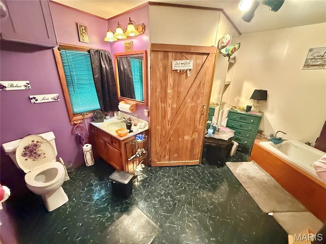 full bathroom featuring a garden tub, toilet, vanity, and tile patterned floors