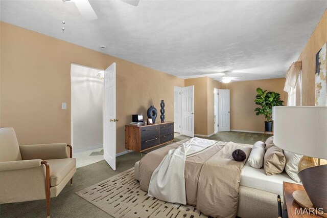 bedroom featuring a ceiling fan, carpet, and baseboards