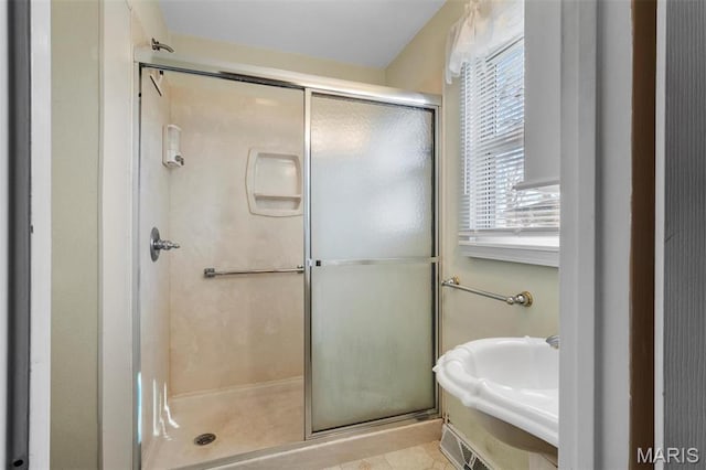 full bathroom featuring a stall shower