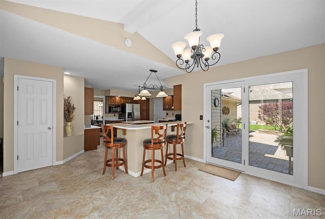 109 Pleasant Ridge Dr, Edwardsville, IL 62025 - kitchen featuring stainless steel refrigerator with ice dispenser, black microwave, a chandelier, a peninsula, and light countertops