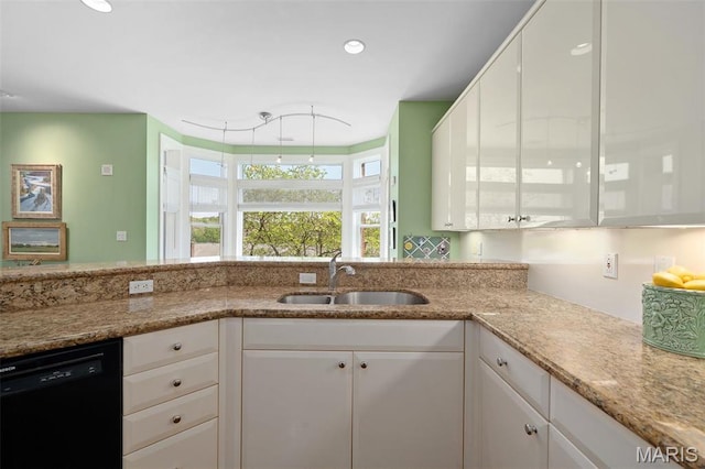 800 S Hanley Rd Unit 2D, Saint Louis, MO 63105 - kitchen with a sink, black dishwasher, white cabinetry, light stone countertops, and recessed lighting
