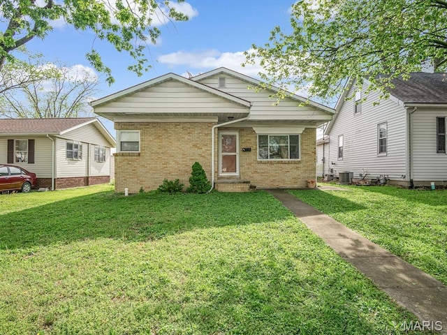 422 Washington St, Red Bud, IL 62278 - view of front of home featuring brick siding, a front lawn, entry steps, and cooling unit