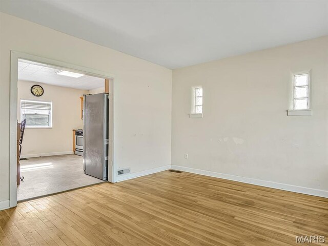 422 Washington St, Red Bud, IL 62278 - unfurnished room featuring light wood-style flooring, baseboards, and plenty of natural light