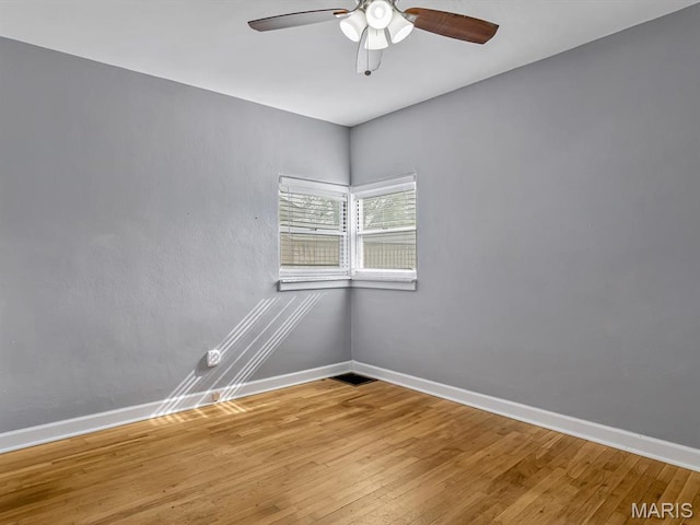 422 Washington St, Red Bud, IL 62278 - unfurnished room with baseboards, ceiling fan, and wood finished floors