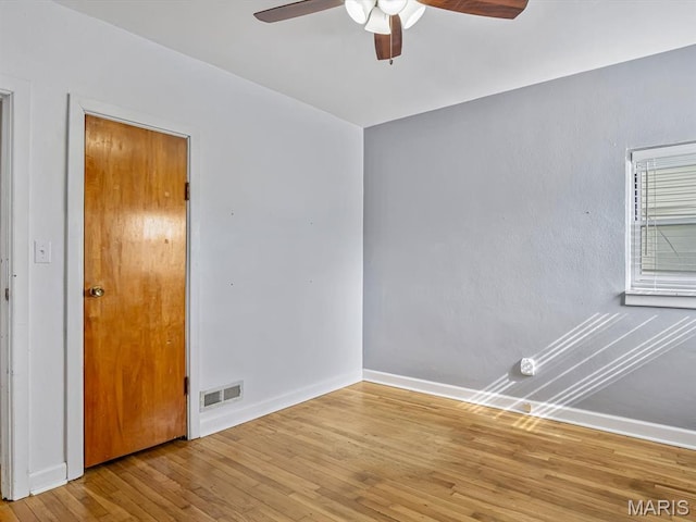422 Washington St, Red Bud, IL 62278 - unfurnished room with a ceiling fan, baseboards, and wood finished floors
