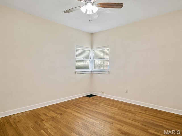 422 Washington St, Red Bud, IL 62278 - spare room featuring light wood finished floors, a ceiling fan, and baseboards