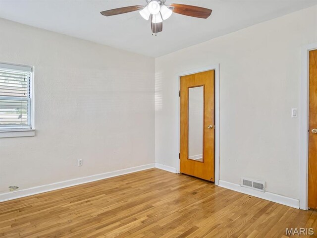 422 Washington St, Red Bud, IL 62278 - spare room featuring a ceiling fan, light wood-type flooring, and baseboards