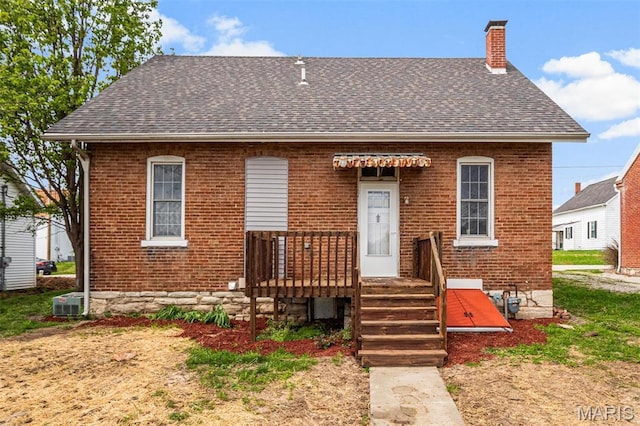 306 Walnut St, Waterloo, IL 62298 - view of front of home with brick siding, a chimney, and roof with shingles