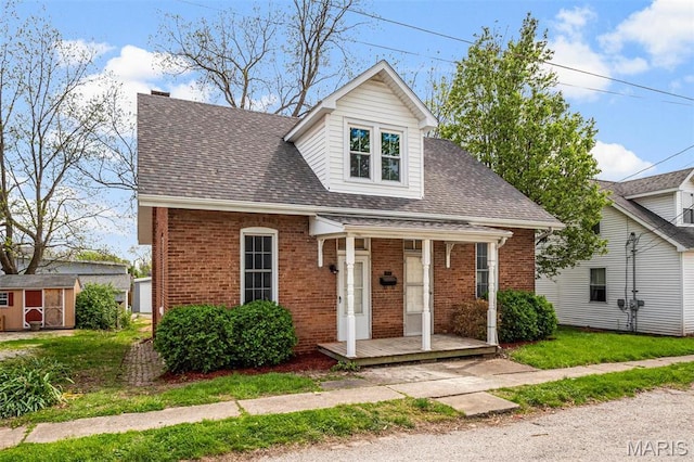306 Walnut St, Waterloo, IL 62298 - view of front of house with brick siding and roof with shingles