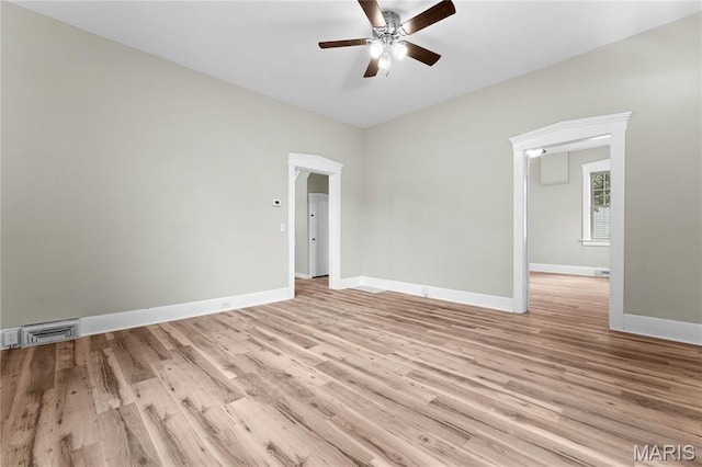 306 Walnut St, Waterloo, IL 62298 - empty room featuring a ceiling fan, baseboards, and light wood finished floors