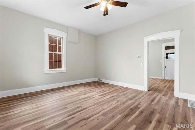 306 Walnut St, Waterloo, IL 62298 - spare room with a ceiling fan, wood finished floors, and baseboards
