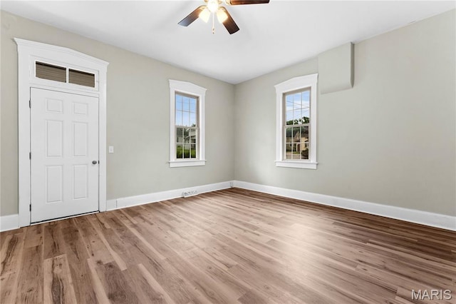 306 Walnut St, Waterloo, IL 62298 - spare room with a ceiling fan, baseboards, and wood finished floors