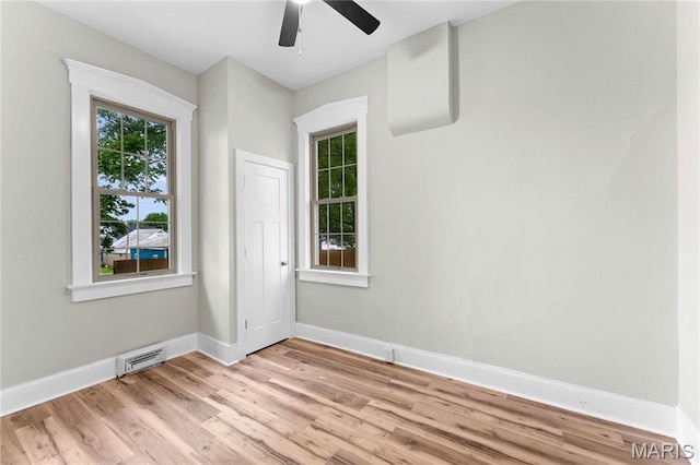306 Walnut St, Waterloo, IL 62298 - unfurnished room featuring ceiling fan, light wood-style floors, and baseboards