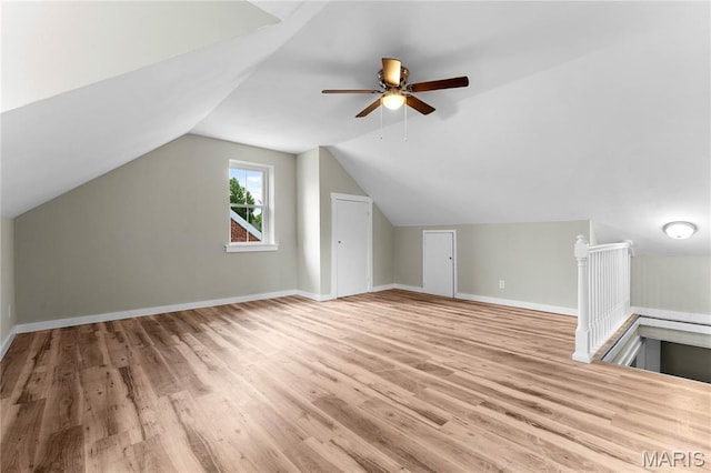306 Walnut St, Waterloo, IL 62298 - additional living space featuring wood finished floors, baseboards, ceiling fan, and vaulted ceiling