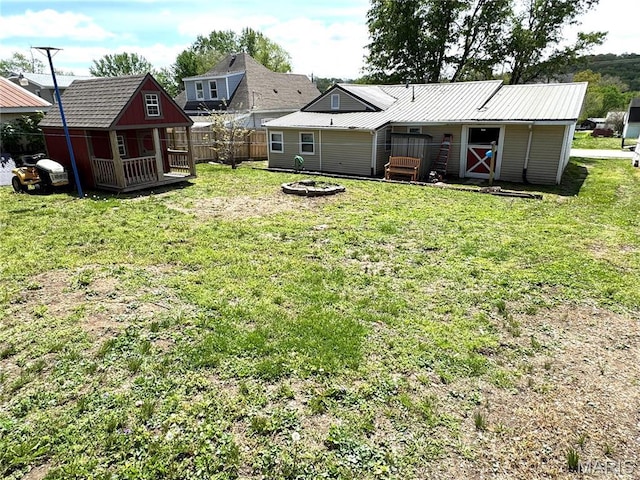 619 Frankford Rd, Louisiana, MO 63353 - view of yard featuring an outdoor structure and a fire pit