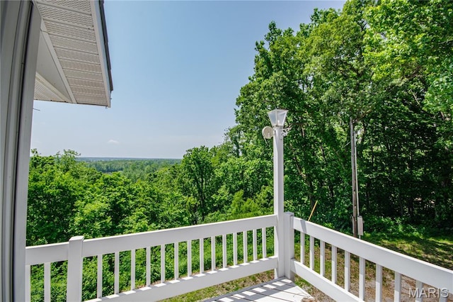 634 N 200th St, Vandalia, IL 62471 - wooden terrace featuring a forest view