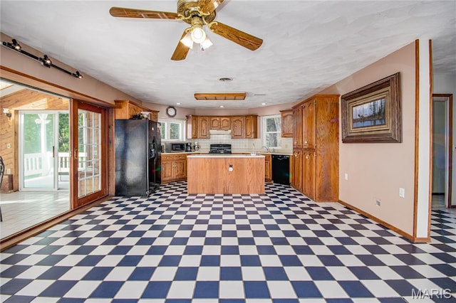 634 N 200th St, Vandalia, IL 62471 - kitchen featuring black appliances, healthy amount of natural light, light countertops, and light flooring