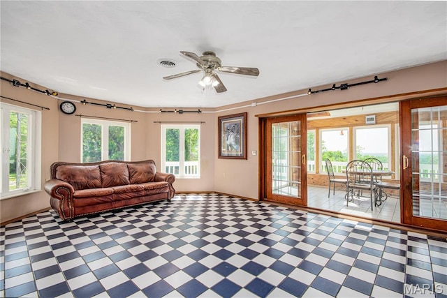 634 N 200th St, Vandalia, IL 62471 - living area with baseboards, tile patterned floors, and a ceiling fan