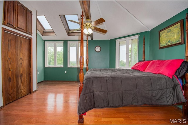 634 N 200th St, Vandalia, IL 62471 - bedroom with multiple windows, light wood finished floors, a skylight, and ceiling fan