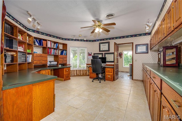 634 N 200th St, Vandalia, IL 62471 - home office featuring rail lighting, wallpapered walls, a ceiling fan, and light tile patterned floors