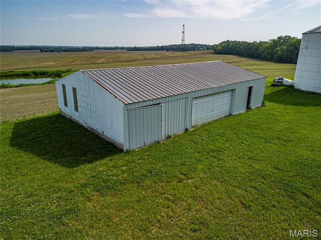 634 N 200th St, Vandalia, IL 62471 - view of pole building with a lawn and a water view
