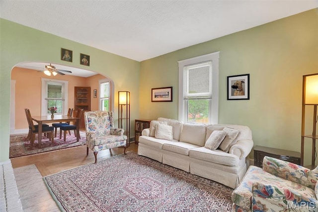 1106 N Oak St, Union, MO 63084 - living room featuring arched walkways, healthy amount of natural light, and ceiling fan