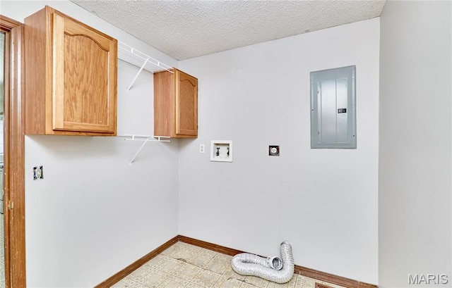 laundry area featuring electric panel, washer hookup, electric dryer hookup, cabinet space, and baseboards