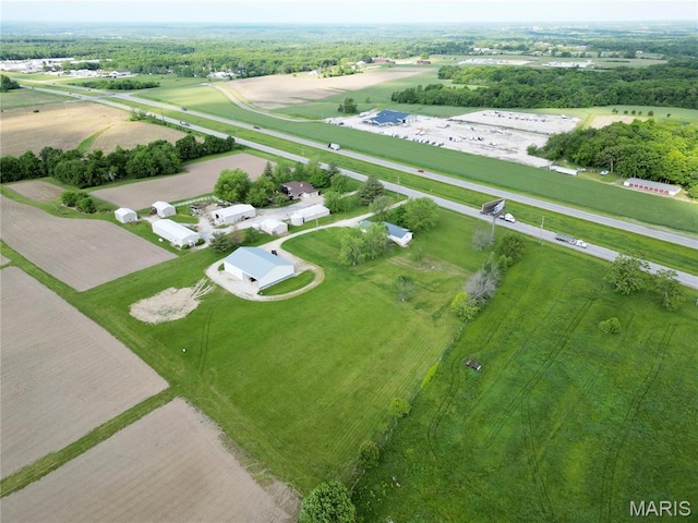 aerial view of property and surrounding area featuring rural landscape