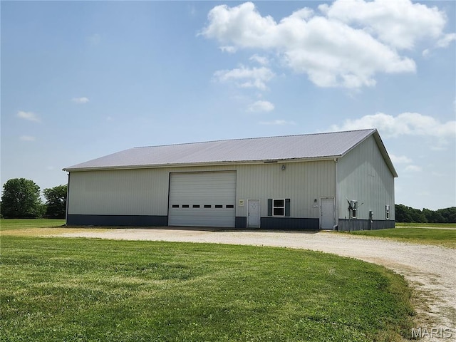 view of outbuilding with an outbuilding and driveway
