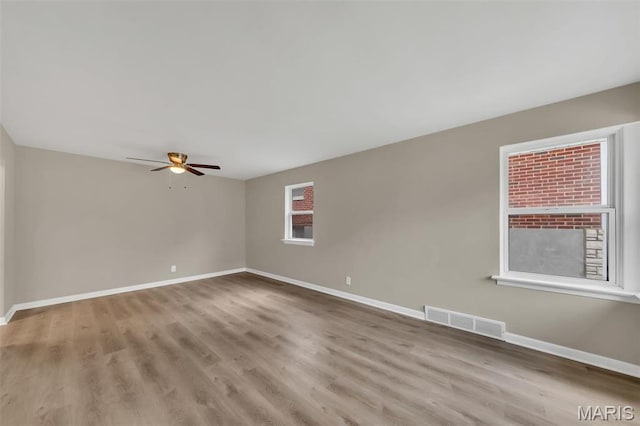 6635 Donald St, Saint Louis, MO 63121 - unfurnished room featuring ceiling fan, baseboards, and wood finished floors