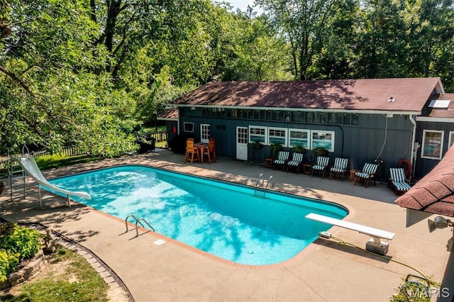 1577 Kehrs Mill Rd, Chesterfield, MO 63005 - outdoor pool featuring a water slide, a diving board, a patio area, and fence